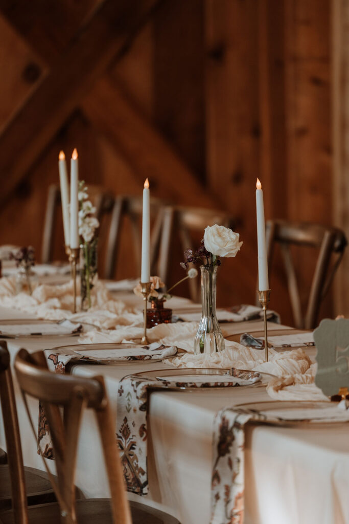 rustic wedding decor and table settings at barn wedding