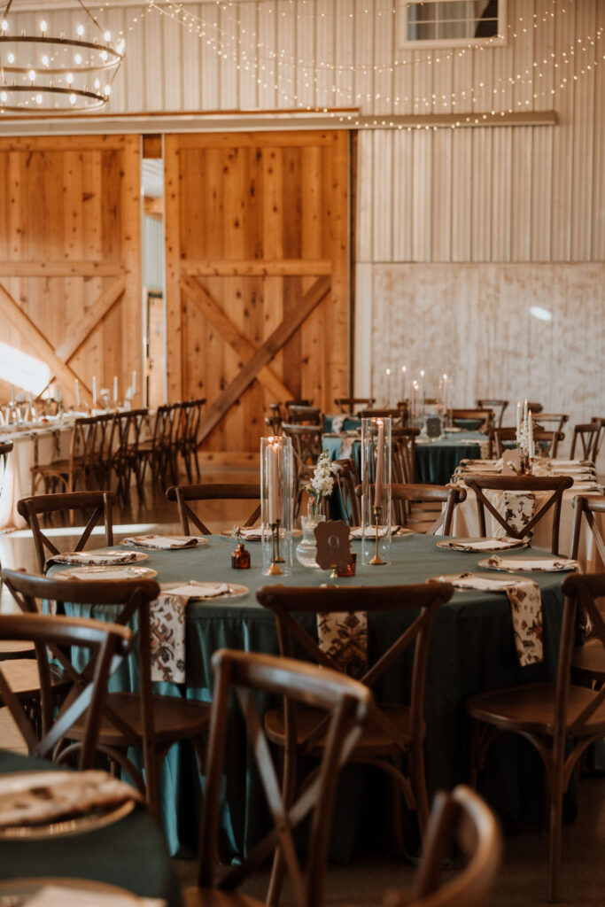 rustic wedding decor and table settings at barn wedding