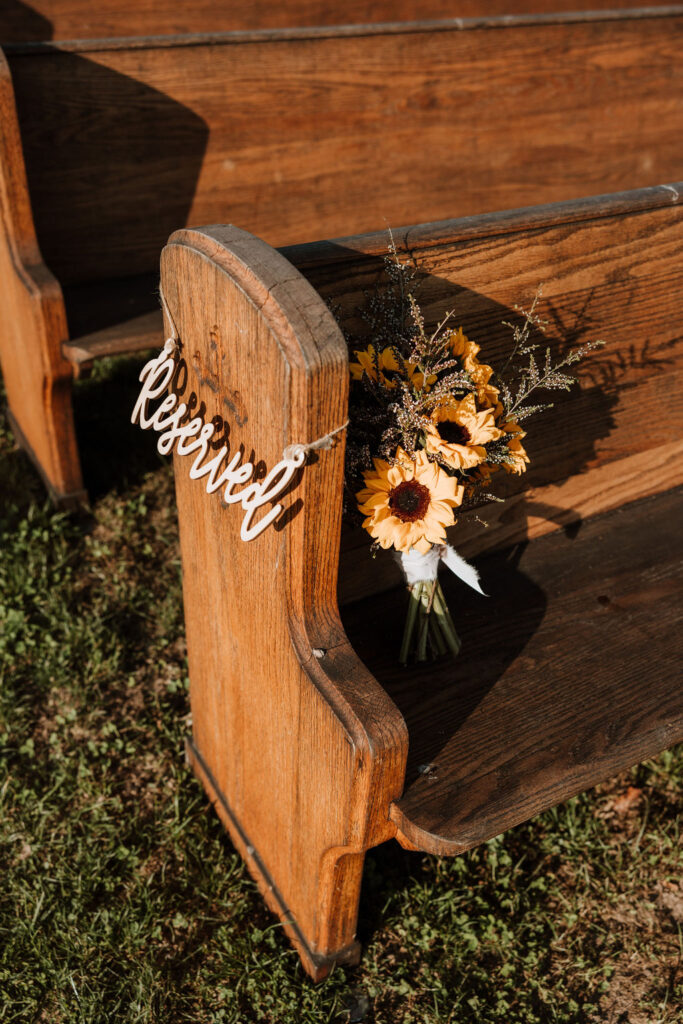 reserved seat and bouquet in wedding pew