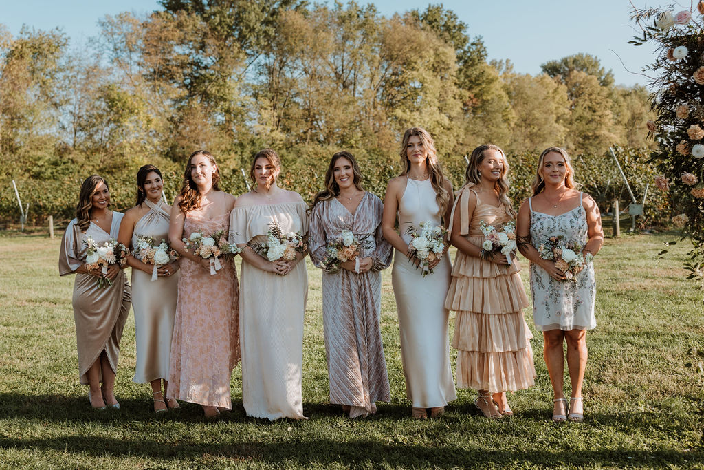 bridesmaids wear different cream colored bridesmaids dresses
