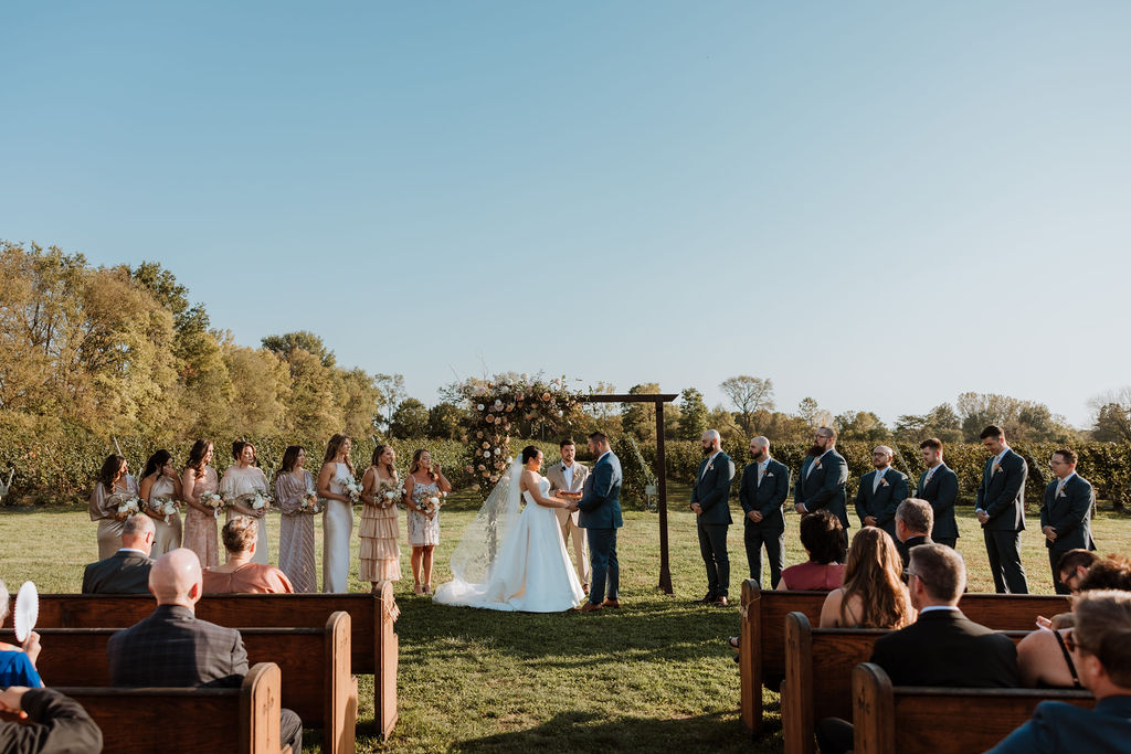 couple exchanges vows at farm wedding