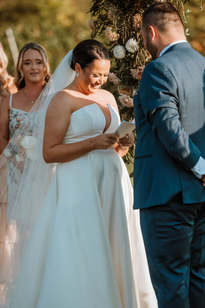 couple exchanges vows at farm wedding venue