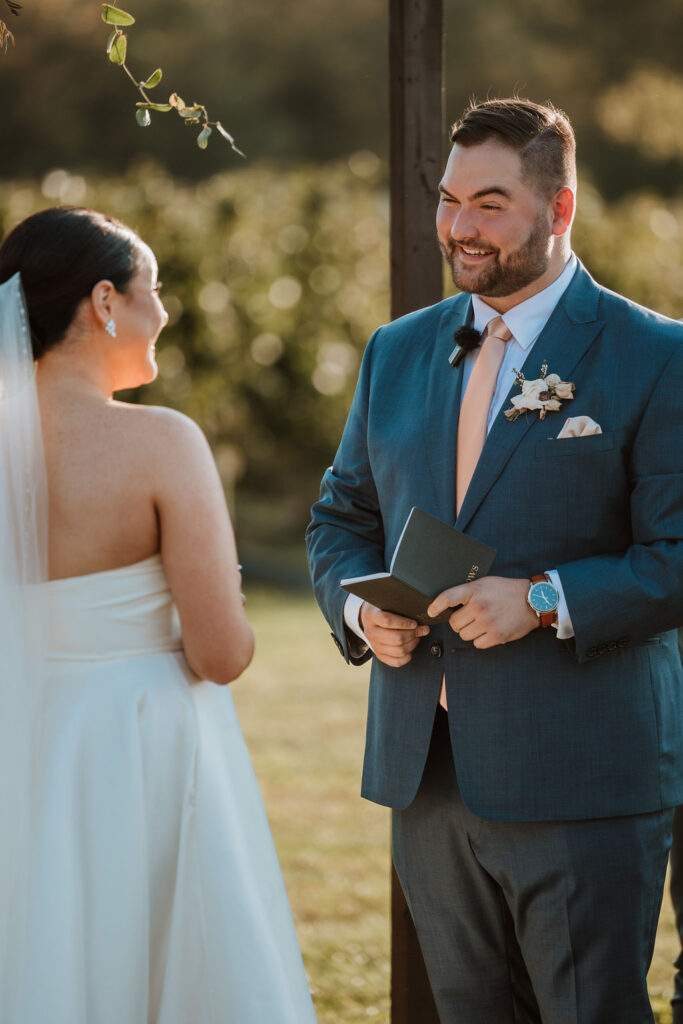 couple exchanges vows at farm wedding venue
