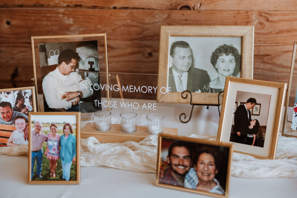 framed photos of loved ones at wedding reception