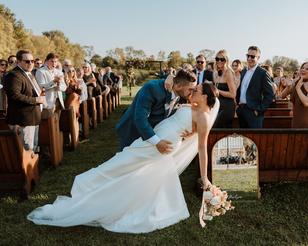 couple kisses during wedding ceremony