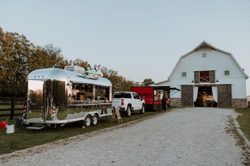 food trucks at barn wedding reception