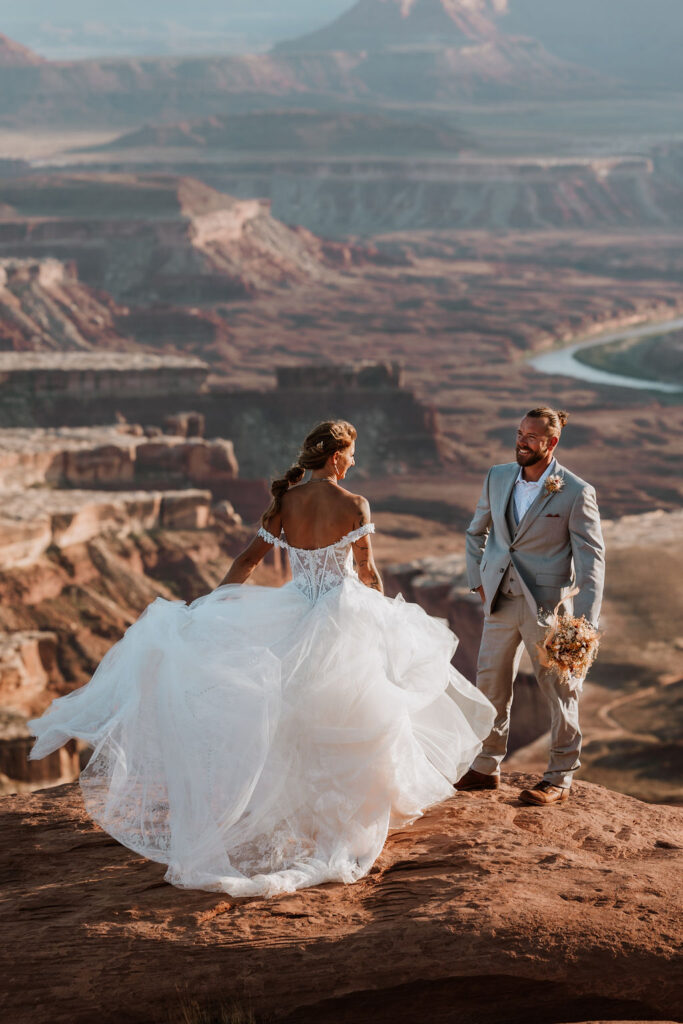 bride twirls wedding dress at Canyonlands National Park elopement