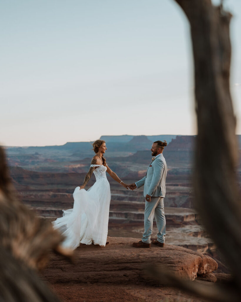 couple holds hands at Canyonlands National Park elopement
