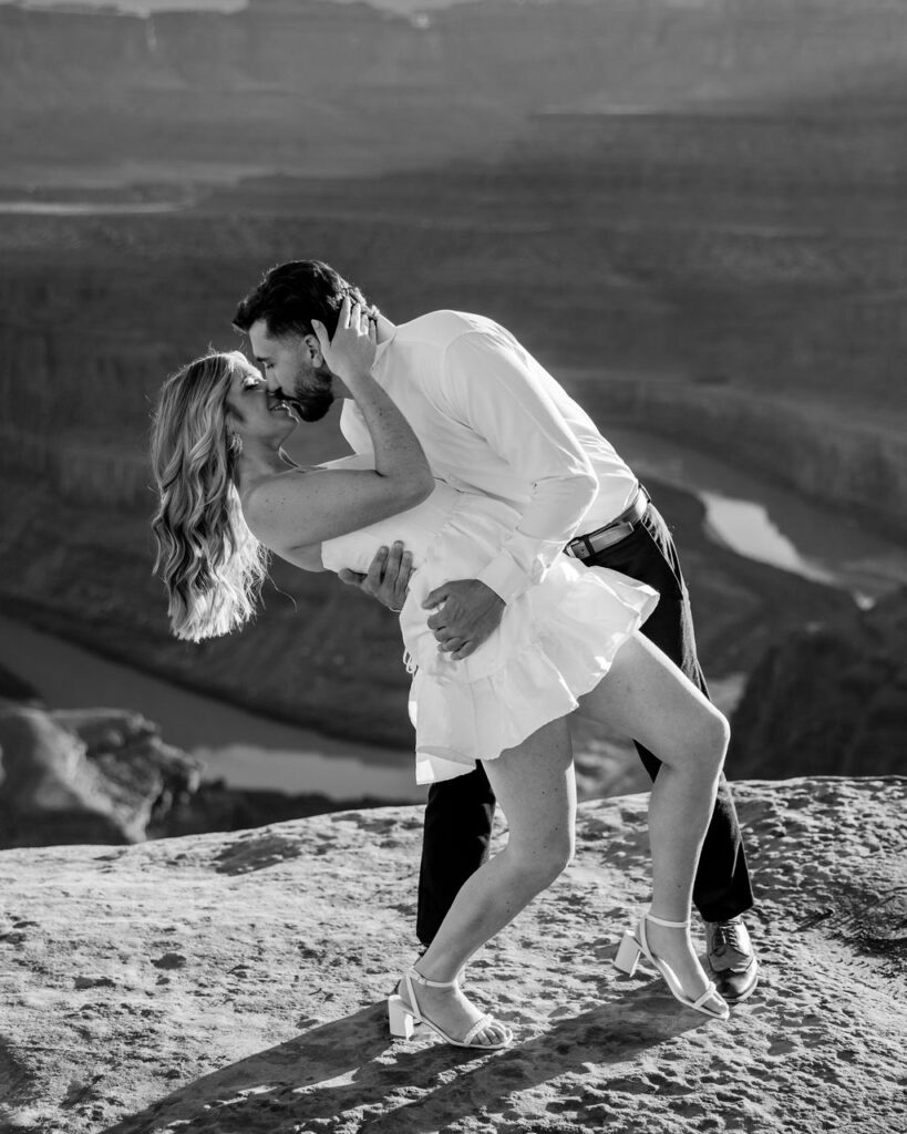 couple kisses at Dead Horse Point Moab engagement