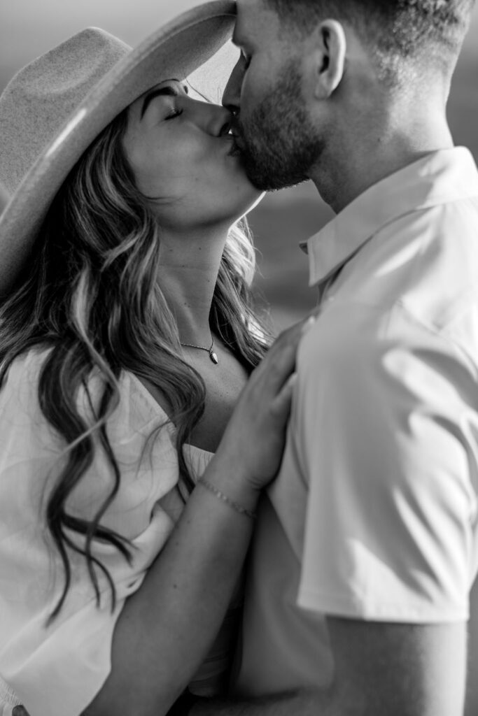 couple kisses at Dead Horse Point Moab engagement