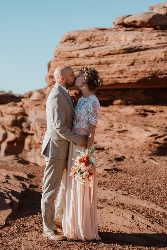 couple kisses at Dead Horse Point State Park