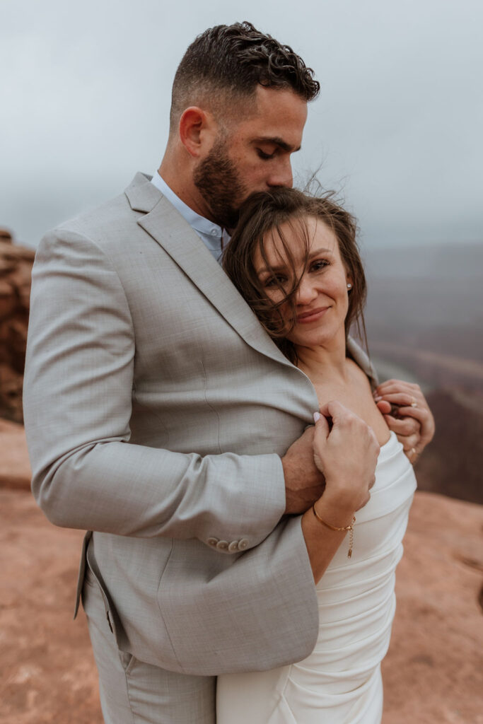 couple poses for wedding day portraits