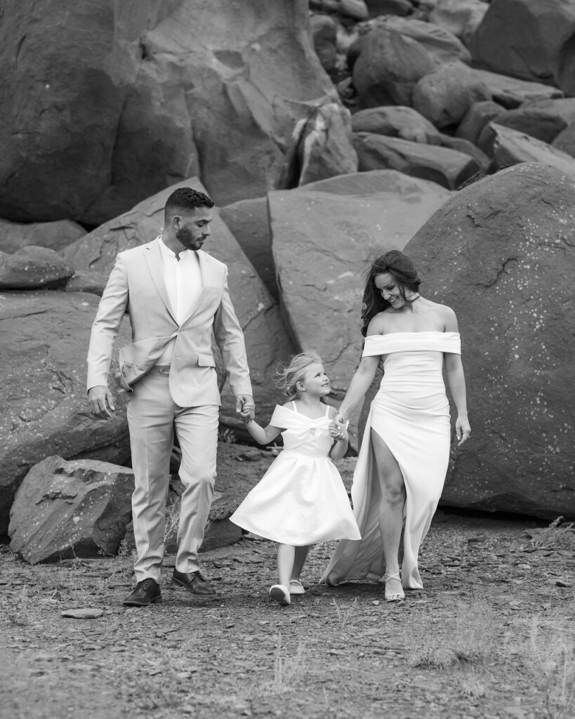family walking through canyon in moab