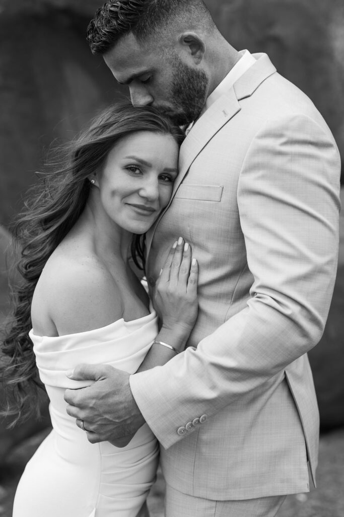 couple embraces for wedding day portraits