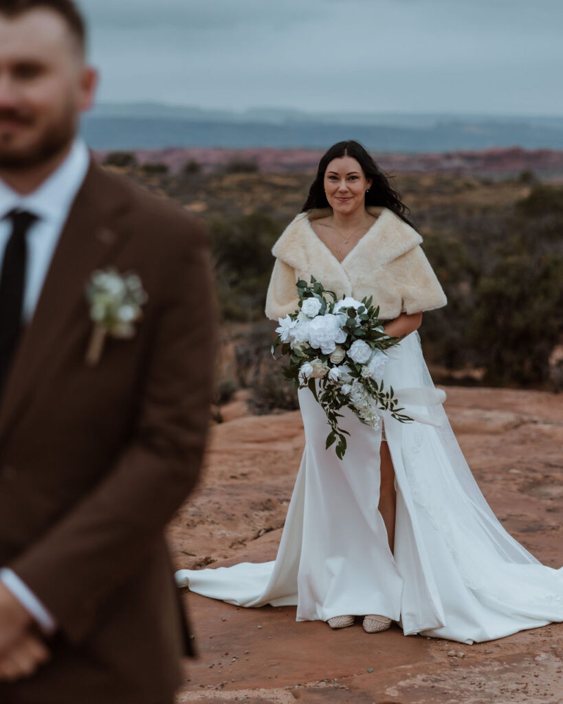 first look of bride and groom during wedding in moab