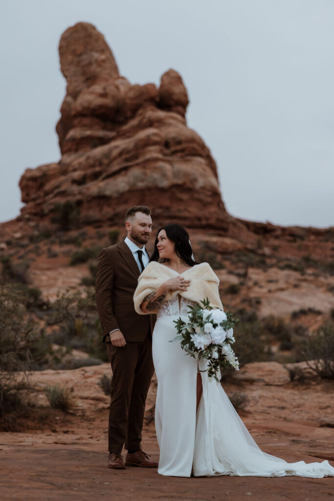 Couple takes portrait photos during wedding in moab