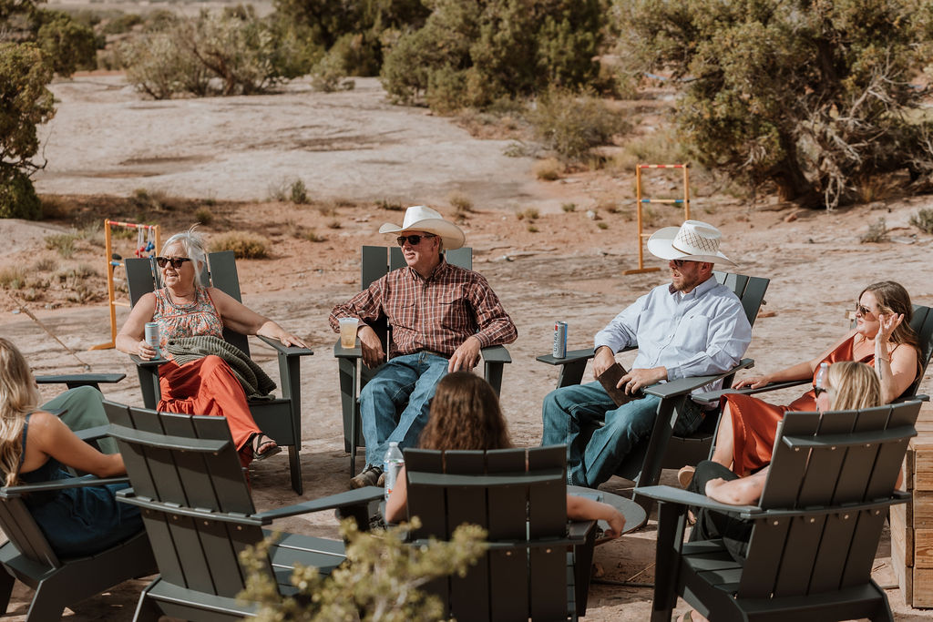 guests sitting around firepit under canvas moab