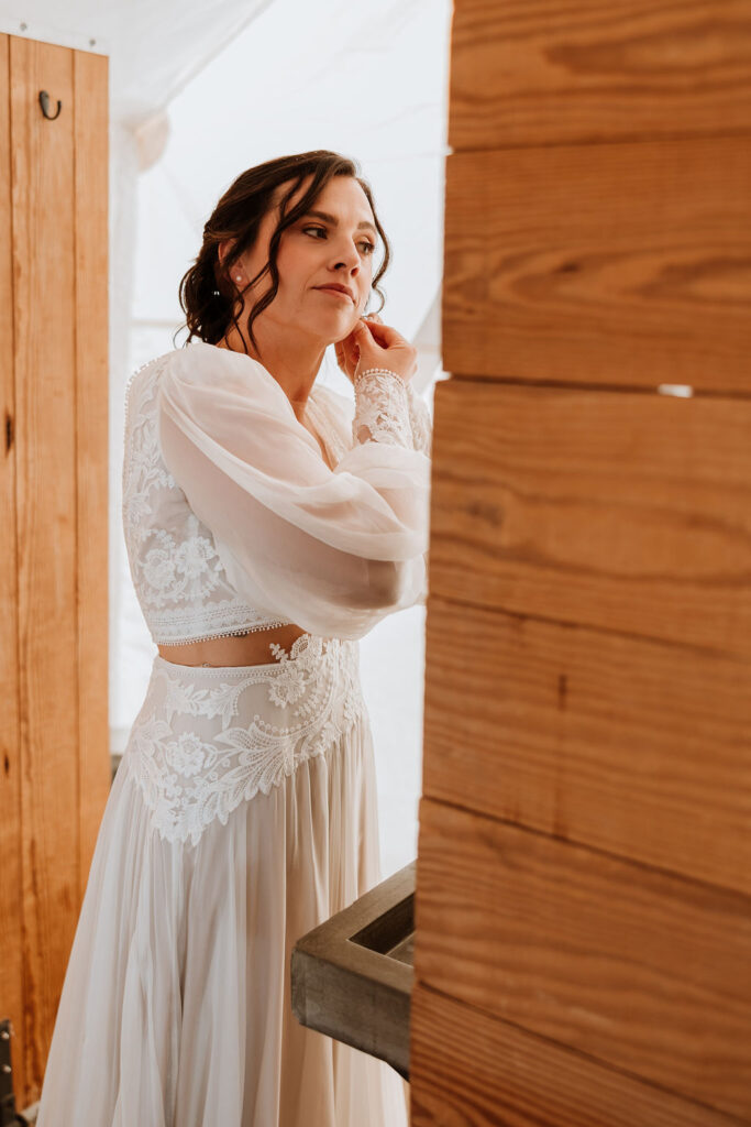 bride getting ready before under canvas moab wedding