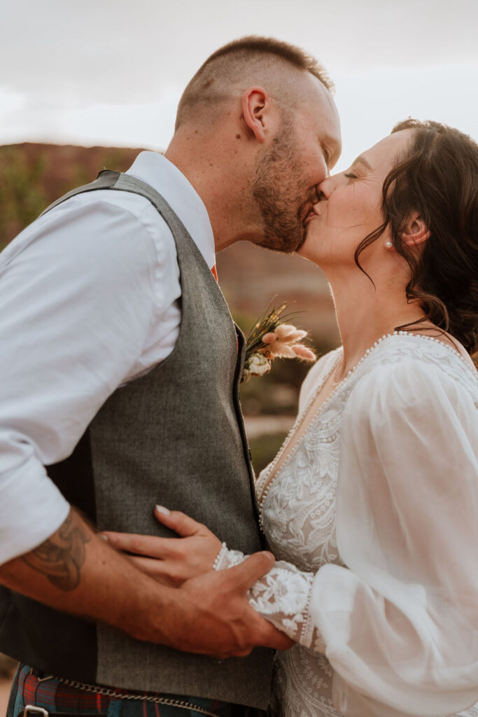 couple kissing during sunset