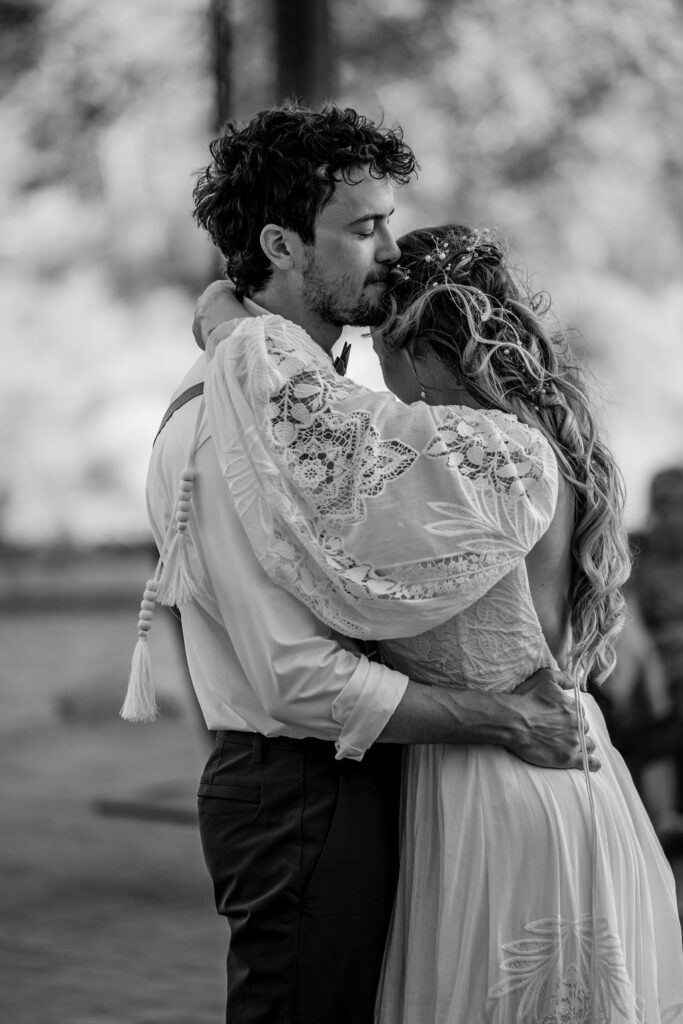 couple embraces during first dance 