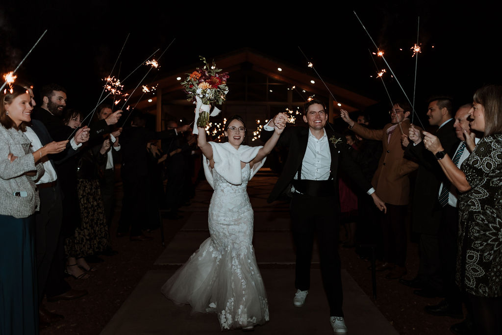 couple walking through sparkler sendoff 
