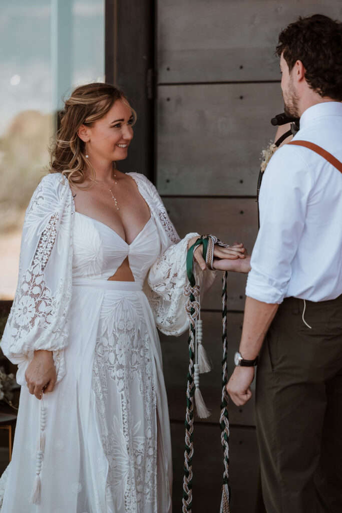 couple participate in handfasting ceremony during wedding ceremony