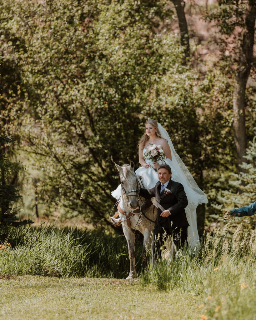 bride entering ceremony on horseback 