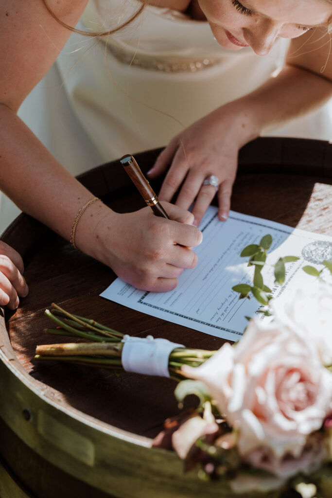 bride signing marriage license 
