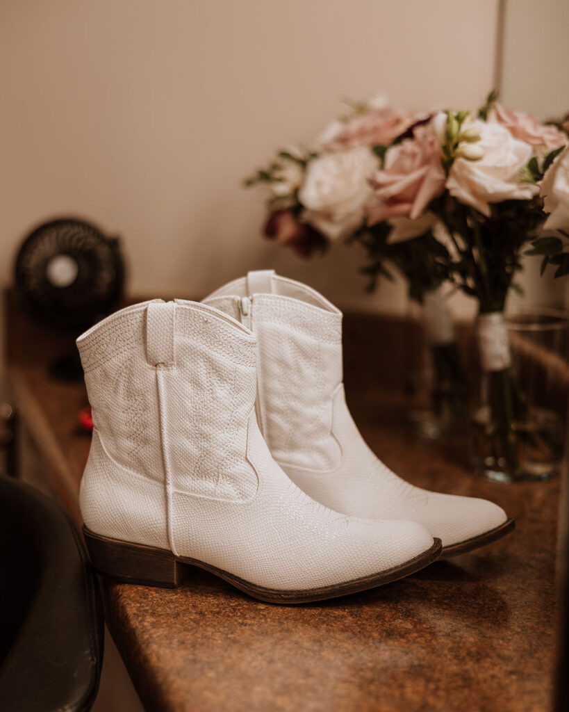 white cowboy boots wore by the bride