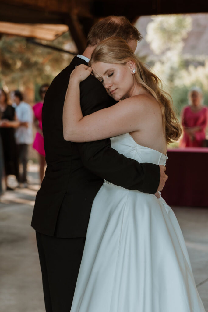 bride and groom dance together 