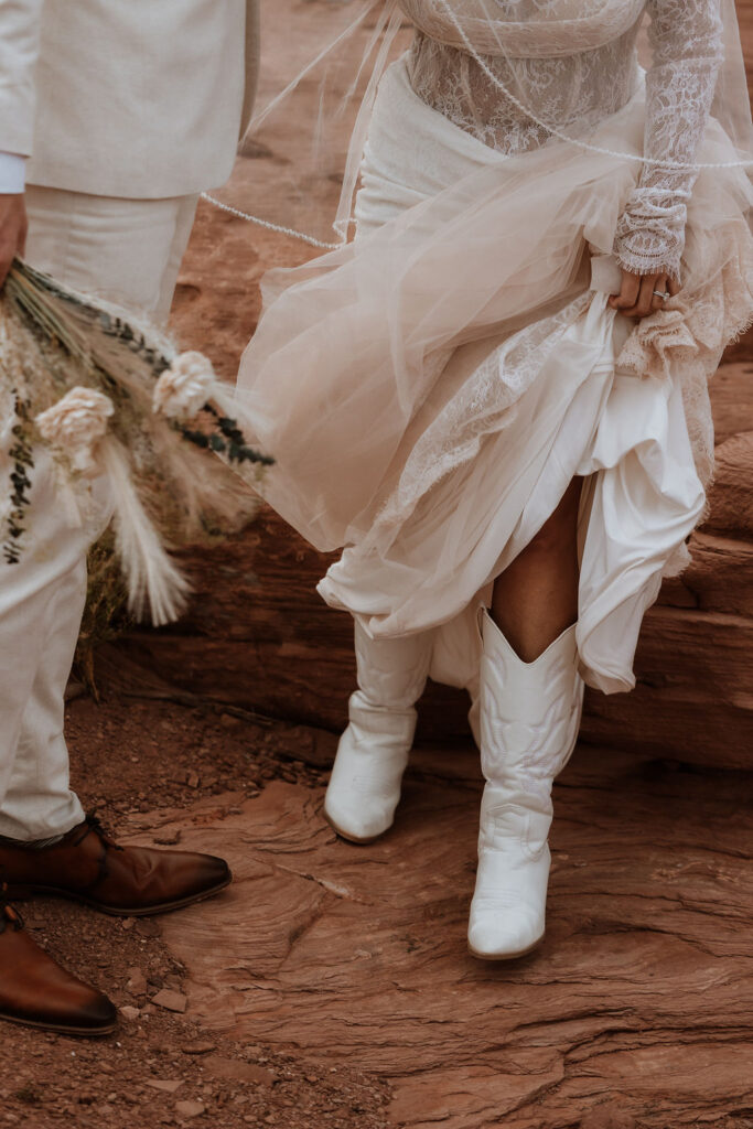 bride showing off cowboy boots