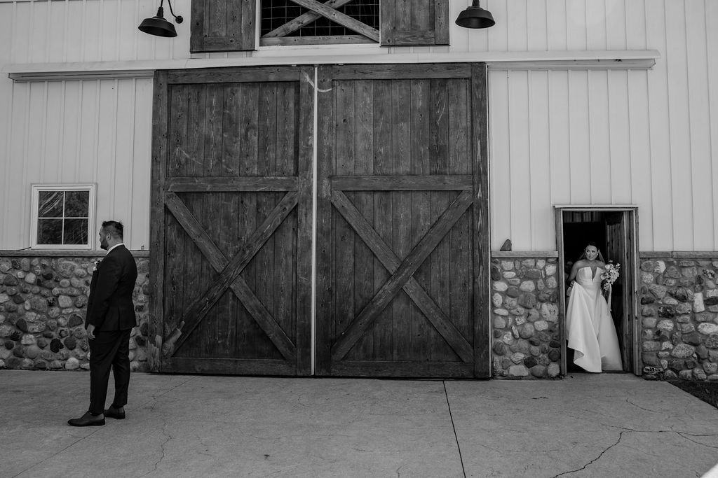 couple stand apart waiting to do their wedding first look
