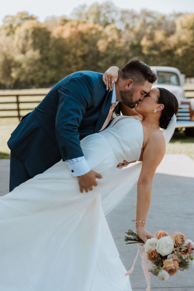 couple kiss after wedding first look