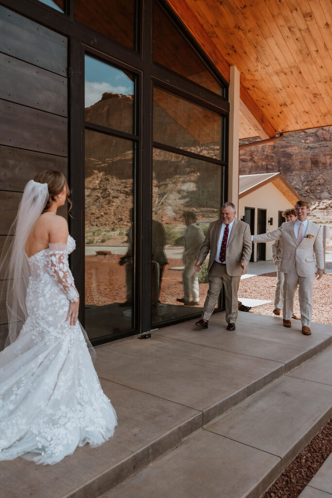 bride does first look with father and brothers