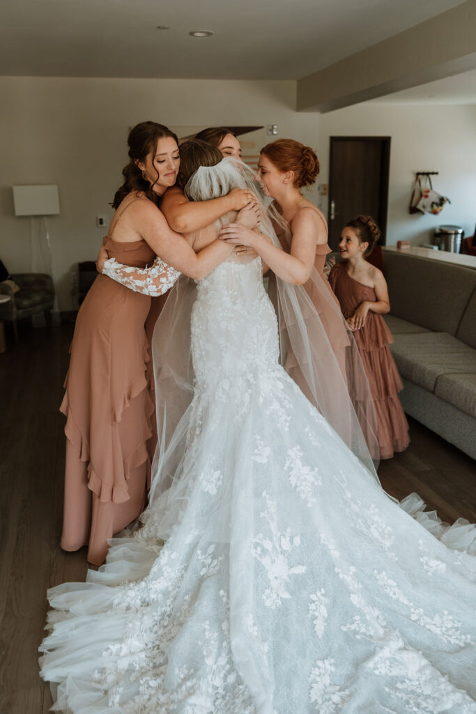 bride does first look with bridesmaids