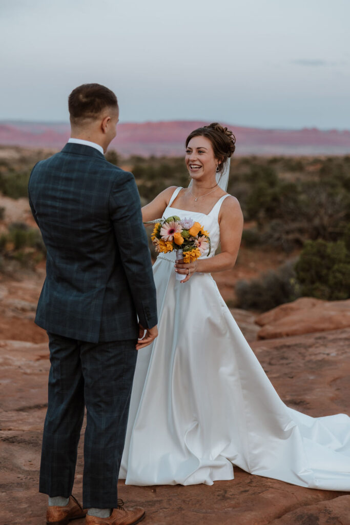 bride laughing with groom after doing wedding first look